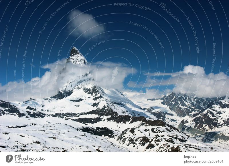 Matterhorn in Clouds II Mountain Elements Sky Ice Frost Snow Rock Alps Peak Snowcapped peak Glacier Gigantic Large Cold Blue White Climate Zermatt Gornergrat