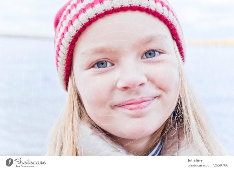 Cute girl in red hat Child Schoolchild Woman Adults Infancy Autumn Hat Blonde Smiling Blue Red White Emotions kid preschooler one Lady six 7 Caucasian European