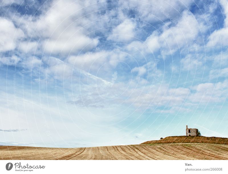 This is a wide field... Nature Landscape Earth Air Sky Clouds Beautiful weather Field Hill Ruin Stone Blue Brown Freedom Far-off places Loneliness Individual