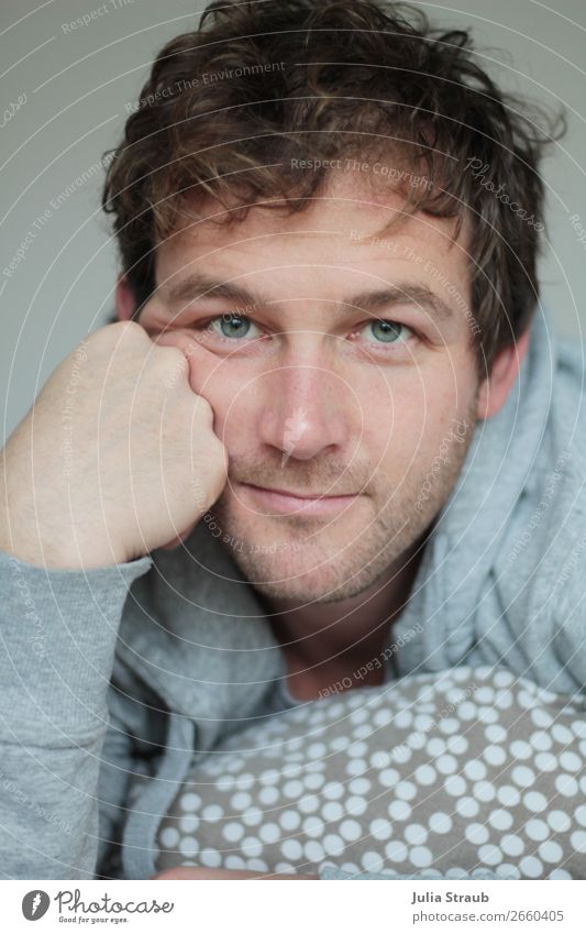 man curls bed blue eyes Bed Bedroom Masculine Man Adults 1 Human being 30 - 45 years Hooded jacket Brunette Curl Designer stubble Lie Looking Beautiful Gray