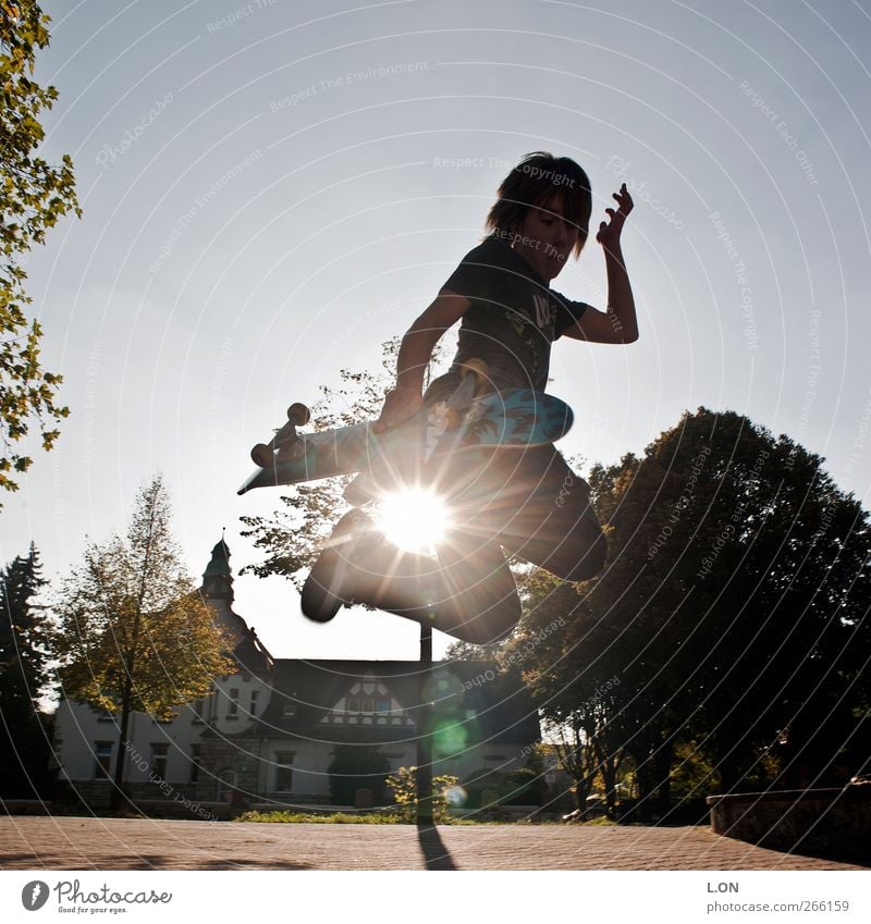 Jump in the sun Inline skating Skateboard Trick jump Skateboarding Human being Masculine Young man Youth (Young adults) 1 Sunlight Movement Sports Athletic Joy