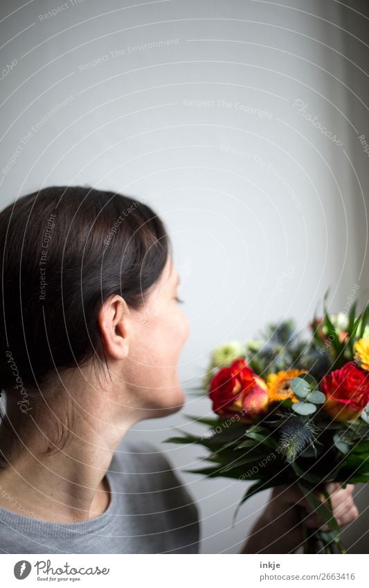 bouquet Interior shot Colour photo Bright Authentic Only one woman Woman Adults Profile Orange Gray Nature Natural Joy Happy Smiling Grateful Mother's Day Love