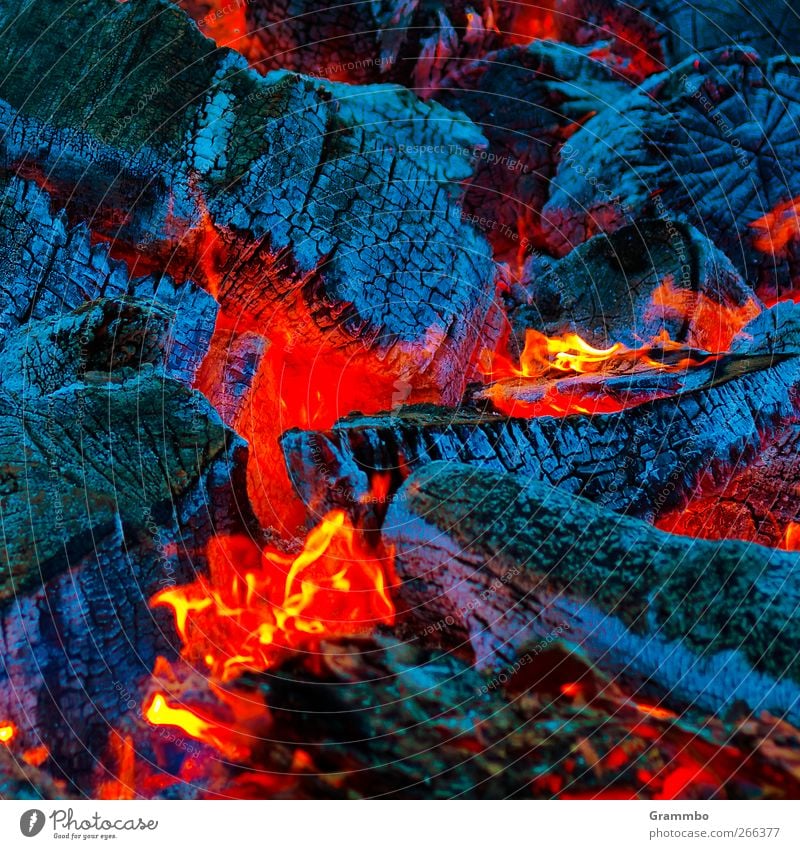 Easter fire core Fire Burn Embers Red Blue Illuminate Bright Colours Flame Warmth Fireplace Camp fire atmosphere Colour photo Exterior shot Close-up