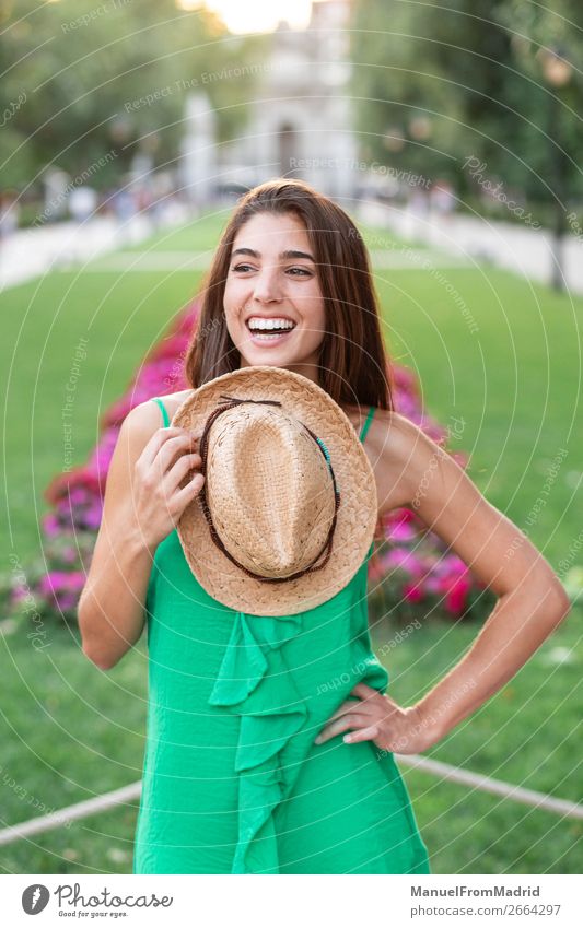 Portrait of a young happy woman in the park Lifestyle Happy Beautiful Vacation & Travel Tourism Summer Human being Woman Adults Nature Park Street Fashion Hat