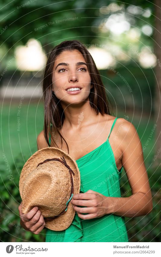 Portrait of a young happy woman in the park Lifestyle Happy Beautiful Vacation & Travel Tourism Summer Human being Woman Adults Nature Park Street Fashion Hat