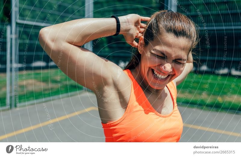 Sportswoman doing arm stretches Lifestyle Joy Happy Personal hygiene Body Summer Human being Woman Adults Fitness Laughter Athletic Authentic Strong arms up