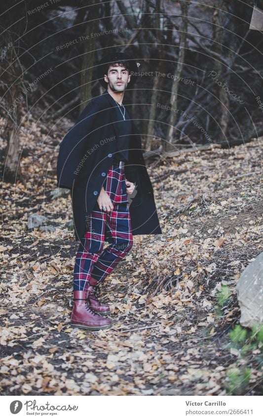 A Young Man standing in the woods Lifestyle Shopping Elegant Style Design Exotic Joy Human being Masculine Young man Youth (Young adults) Environment Nature