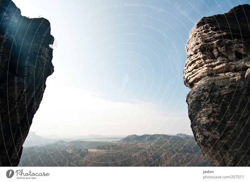 on the edge of a rock. Far-off places Mountain Sky Horizon Beautiful weather Rock Elbsandstone mountains Saxon Switzerland Infinity Bright Bizarre Eternity