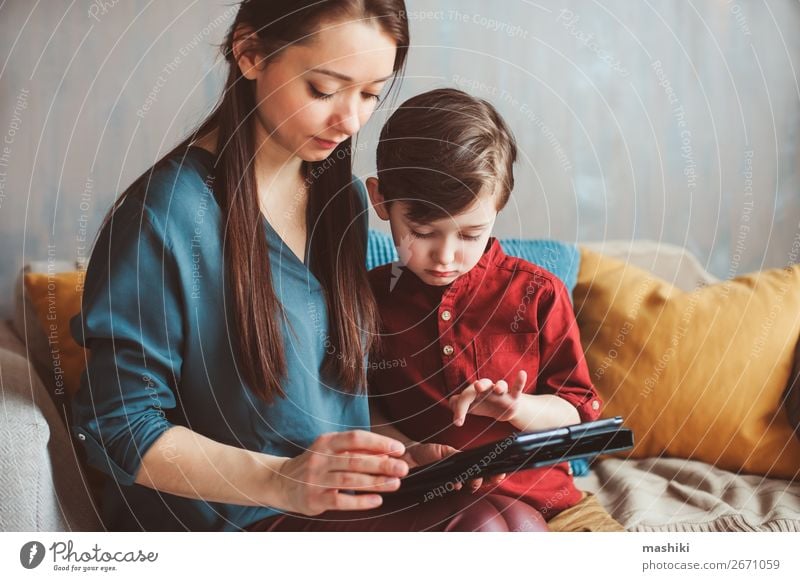 happy mother and toddler son using tablet Lifestyle Joy Relaxation Leisure and hobbies Playing Child School Computer Screen Technology Internet Boy (child)