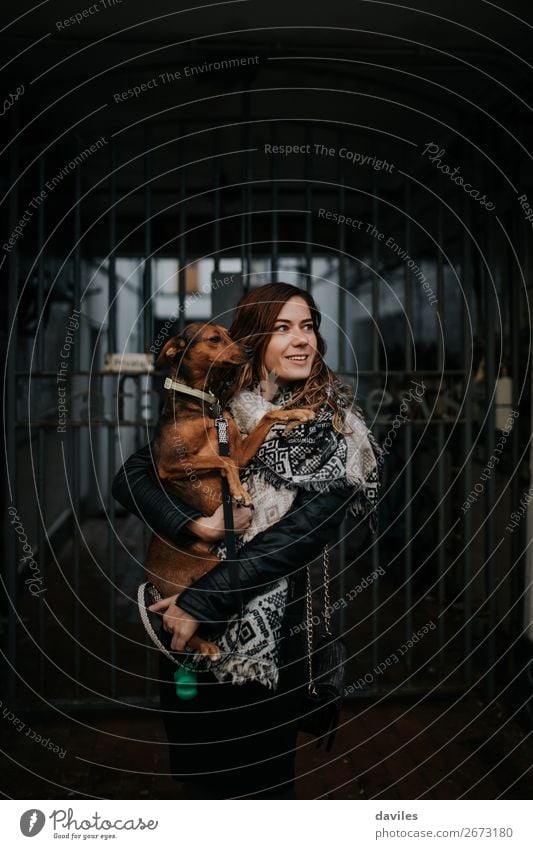 Woman with her dog in the arms. Lifestyle Vacation & Travel Human being Young woman Youth (Young adults) Adults Friendship 1 30 - 45 years England Europe Street