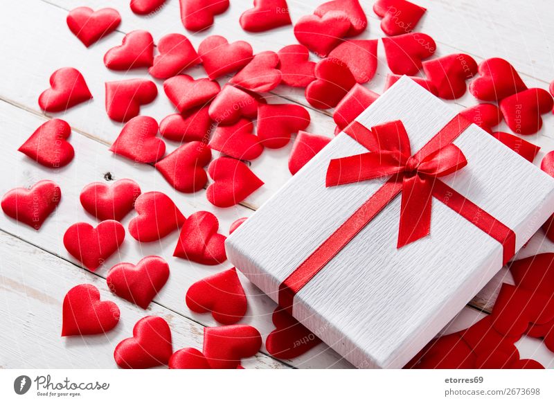 Red hearts and gift box on white wooden background. Heart Pattern Gift Present Day Neutral Background Love Valentine's Day Romance Vacation & Travel