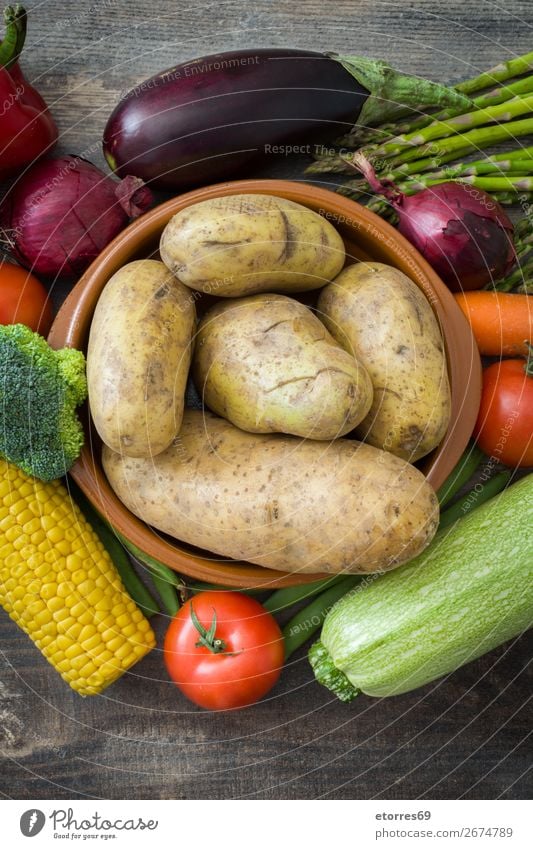 Vegetables and fruit on wood Food Healthy Eating Food photograph Fruit Nutrition Vegetarian diet Diet Multicoloured Yellow Green Red Zucchini Tomato Maize Onion