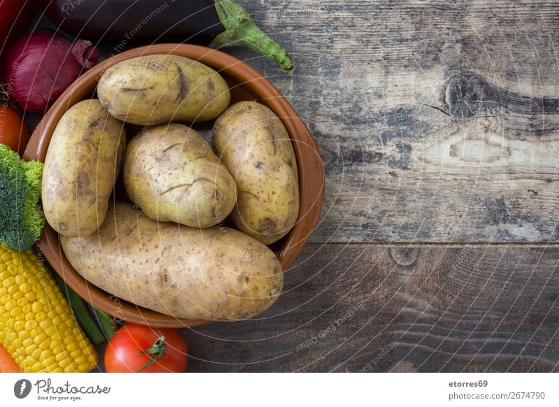 Vegetables and fruit on wood Food Healthy Eating Food photograph Fruit Nutrition Vegetarian diet Diet Multicoloured Yellow Green Red Zucchini Tomato Maize Onion