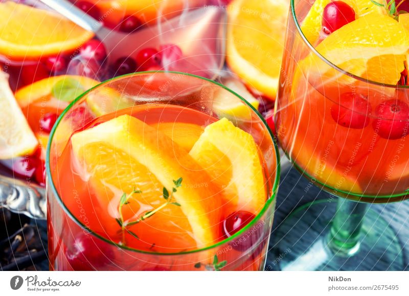 Sangria in glasses sangria alcohol punch drink wineglass orange fruit cranberries cold beverage juice cocktail fresh summer refreshment sweet lemon citrus