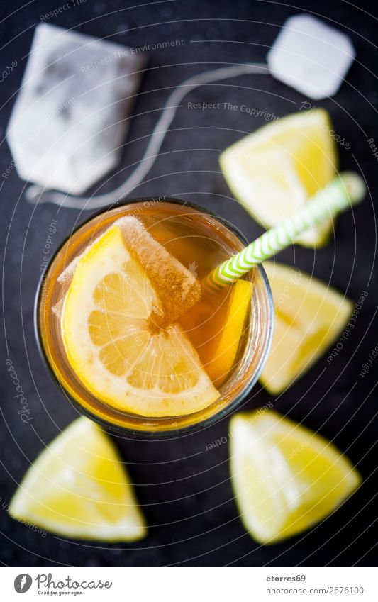 Traditional iced tea with lemon and ice in tall glass Iced tea Lemon Tea Beverage Summer Food Healthy Eating Food photograph Cold Juice Fresh Mint Orange Fruit