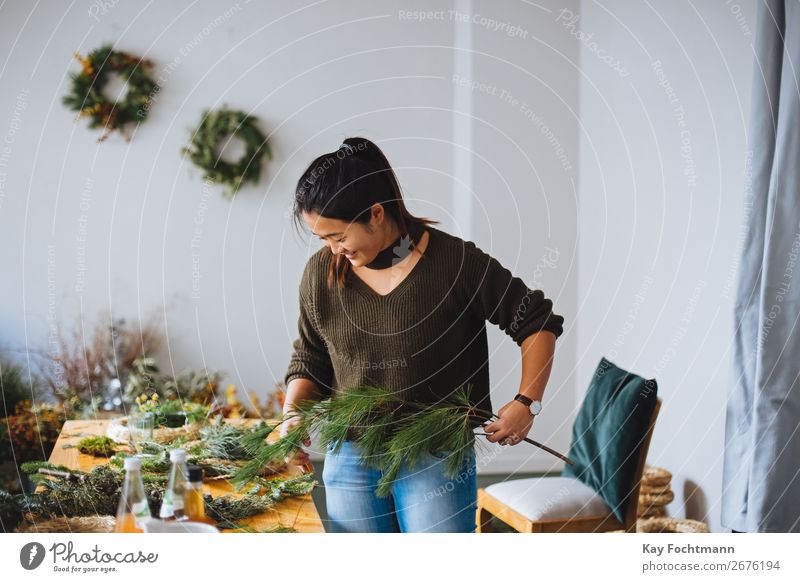 women are preparing christmas decorations Business Entrepreneur Flowers Plants Small Business Woman Working advent advent wreath arrangement asian branch