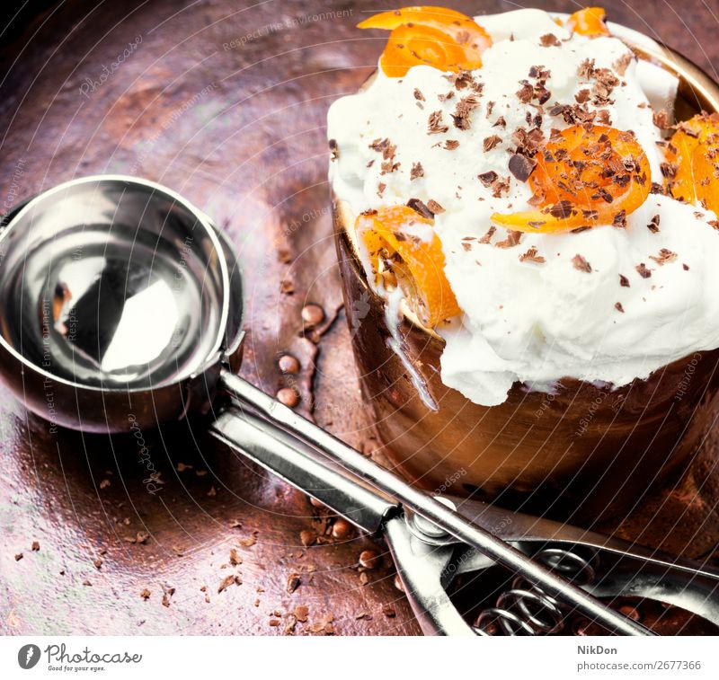 Delicious orange icecream sundae sweet ice-cream scoop dessert white summer flavor frozen delicious vanilla ice cream bowl creamy caramel spoon