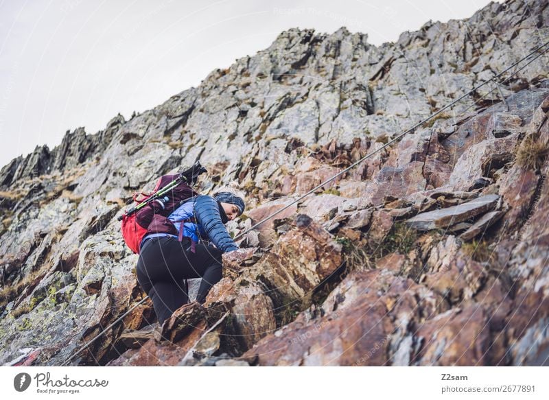 Young woman on the Hirzer via ferrata Vacation & Travel Expedition Hiking Climbing Mountaineering Youth (Young adults) Nature Landscape Beautiful weather Rock