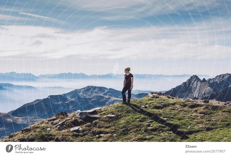 Young woman on the summit Vacation & Travel Hiking Climbing Mountaineering Youth (Young adults) Nature Landscape Sky Summer Beautiful weather Alps Peak Stand