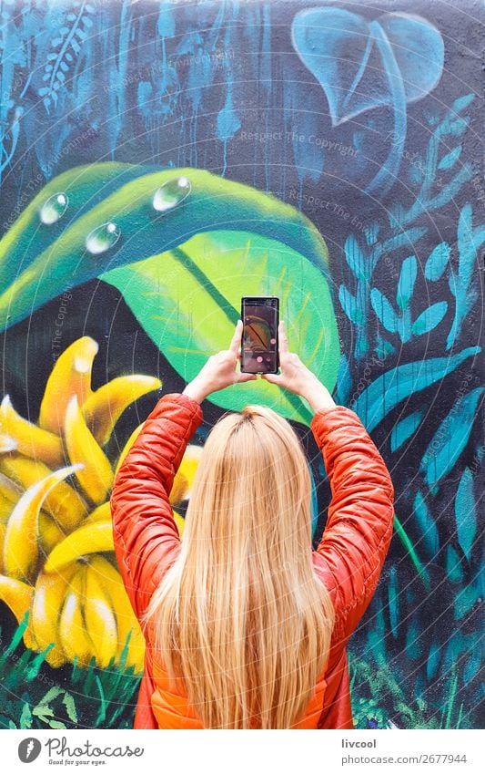 Tourist captures details of Melbourne graffiti-Australia Lifestyle Design Vacation & Travel Tourism Telephone Camera Human being Feminine Woman Adults