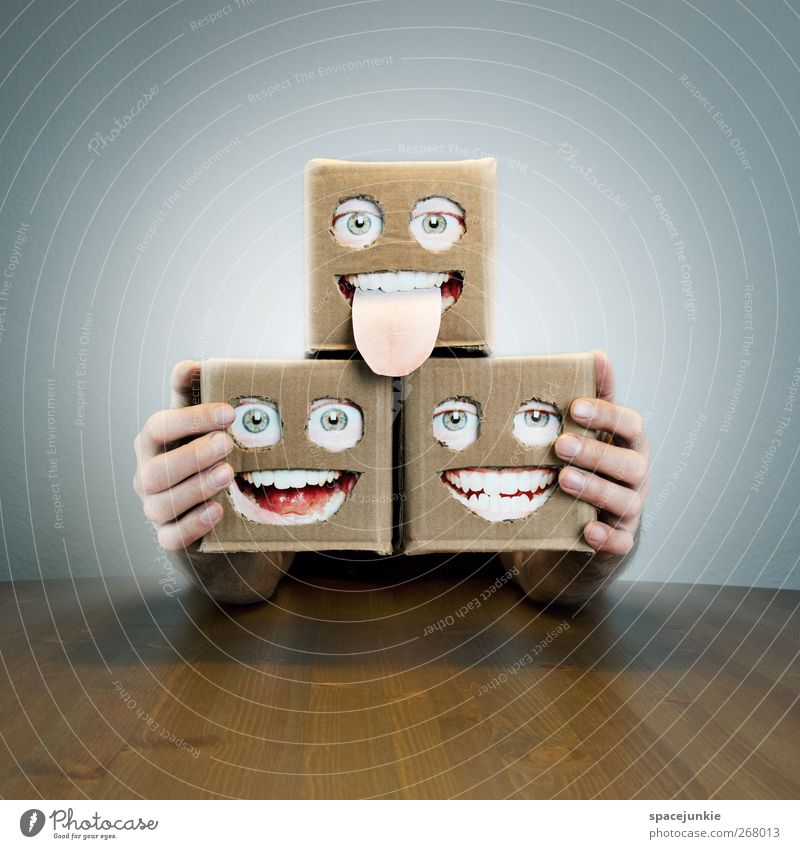 trio of artists Artist Observe Smiling Laughter Scream Looking Illuminate Exceptional Creepy Small Trashy Cardboard Face Eyes Mouth Table Robot 3 Crazy surreal