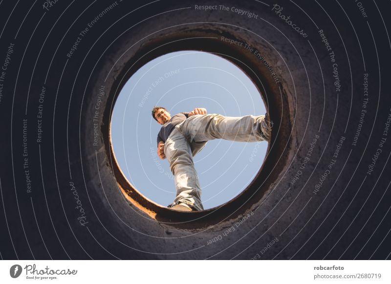 man looking through hole Face Desk Business Human being Man Adults Tube Wood Observe Blue Brown Green Safety Protection Horror Dangerous Colour Surveillance