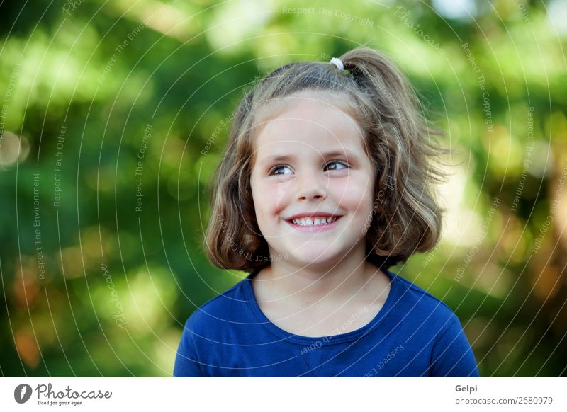 Cute little girl on the park Lifestyle Joy Happy Beautiful Face Summer Child Human being Woman Adults Infancy Nature Plant Flower Park Blonde Smiling Happiness