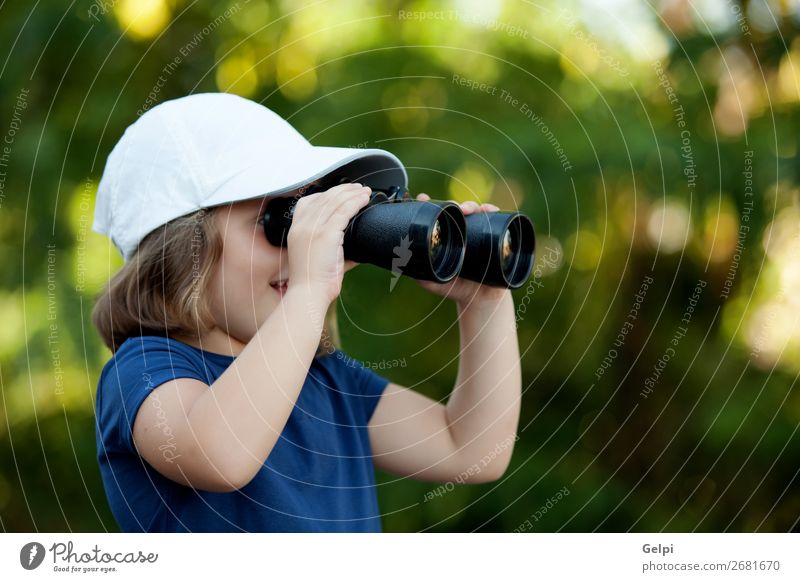 Little cute girl in the park looking by binoculars Joy Happy Beautiful Face Life Leisure and hobbies Vacation & Travel Camping Summer Child Human being Toddler