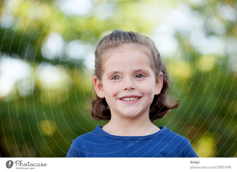 Cute little girl on the park Lifestyle Joy Happy Beautiful Face Summer Child Human being Woman Adults Infancy Nature Plant Flower Park Blonde Smiling Happiness