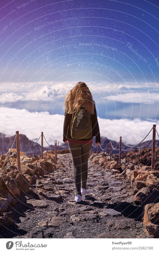 Woman walking on Teide Mountain, with the stars in the sky Lifestyle Wellness Harmonious Hiking Feminine Young woman Youth (Young adults) 1 Human being