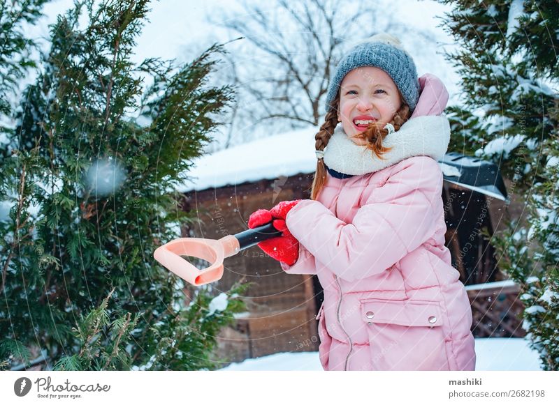 kid girl helping to clean pathway from snow with showel Playing Winter Snow House (Residential Structure) Garden Child Work and employment Tool Weather Storm