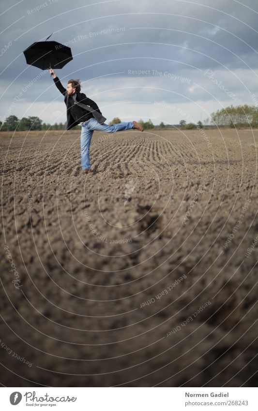 The wind carries me Contentment Masculine Young man Youth (Young adults) 1 Human being 18 - 30 years Adults Earth Sky Field Umbrella Flying Esthetic Joy Happy