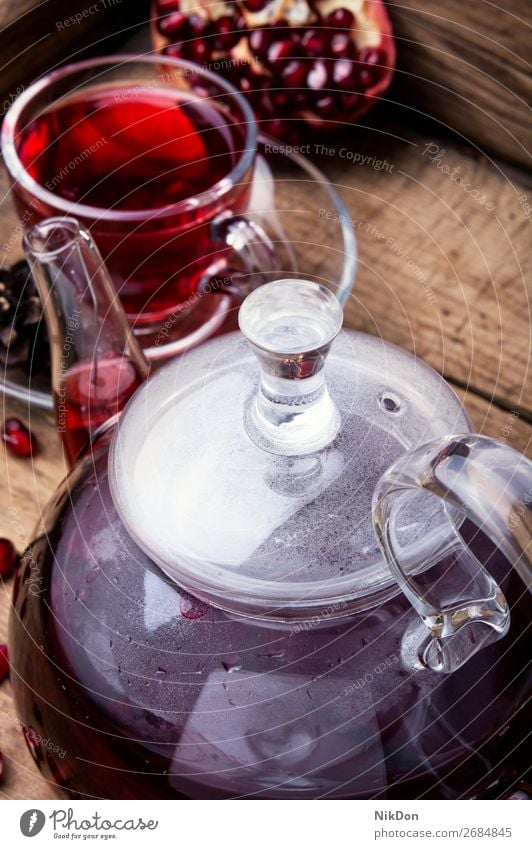 warm pomegranate tea. drink red healthy cup fruit glass beverage antioxidant kettle vitamin hot teapot ripe tropical teakettle teacup mug turkish slice