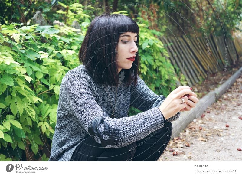 brunette woman sitting on ground in a park Lifestyle Style Happy Beautiful Relaxation Calm Human being Feminine Young woman Youth (Young adults) Woman Adults 1