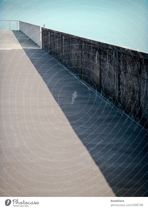 off Sky Cloudless sky Lakeside Port City Deserted Harbour Bridge Wall (barrier) Wall (building) Lanes & trails Blue Gray Calm Infinity Light Shadow