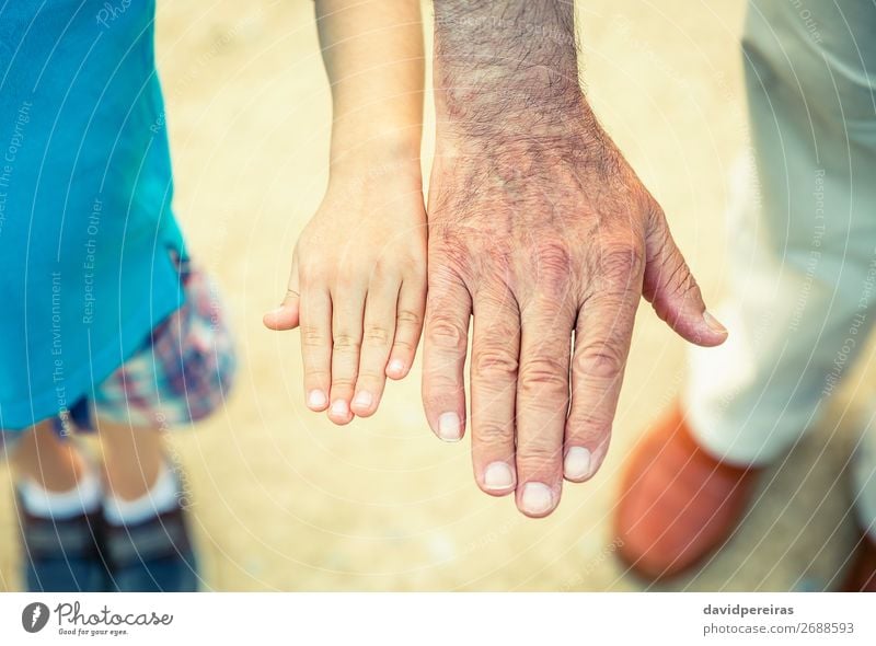 Child and senior man comparing his hands size Skin Life Retirement Human being Baby Boy (child) Man Adults Parents Father Grandfather Family & Relations Hand