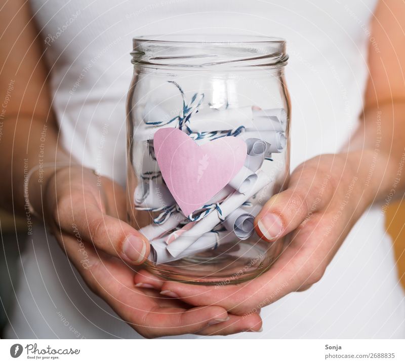 preserving jar with pink heart and notes Lifestyle Human being Feminine Young woman Youth (Young adults) Hand 1 18 - 30 years Adults Piece of paper