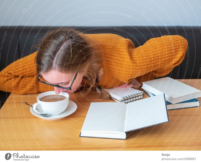 Young tired student drinks a cup of coffee Hot drink Coffee Lifestyle Study University & College student Feminine Young woman Youth (Young adults) 1 Human being