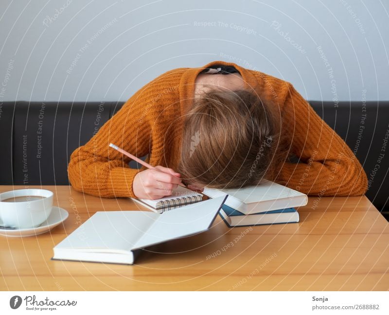 Young woman with her head on a pile of books Coffee Lifestyle Study University & College student Feminine Youth (Young adults) 1 Human being 18 - 30 years