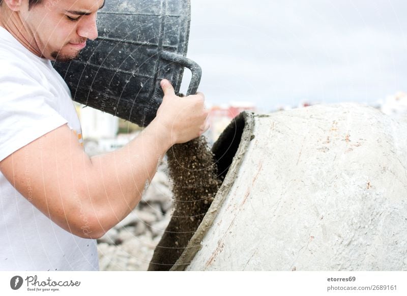 man working at a construction site Man Work and employment Construction Construction worker craftsman Cement form liquid Fluid Tool Masonry Sand Level vibrator