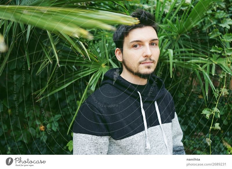 young attractive man in calm surrounded by plants Lifestyle Style Face Human being Masculine Young man Youth (Young adults) Man Adults 1 30 - 45 years Nature