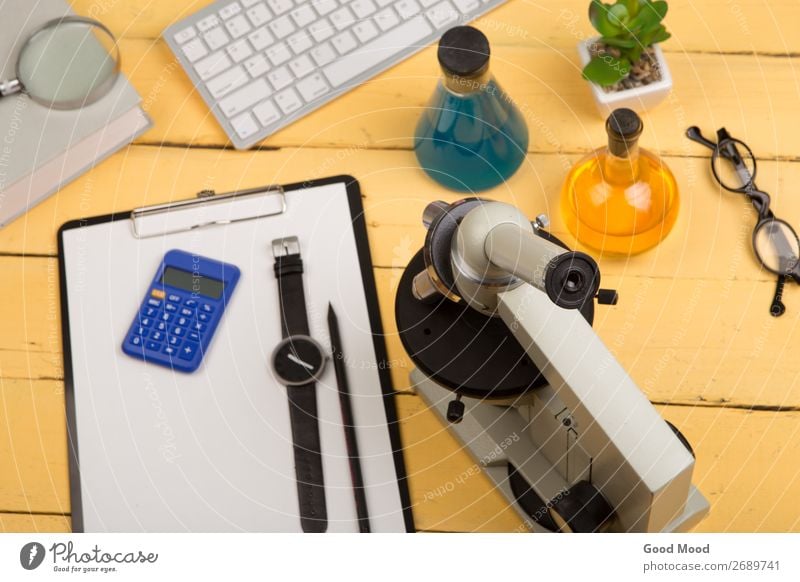 microscope, book, magnifying glass, clipboard, chemical liquids Bottle Desk Table Science & Research School Study Classroom Academic studies Laboratory