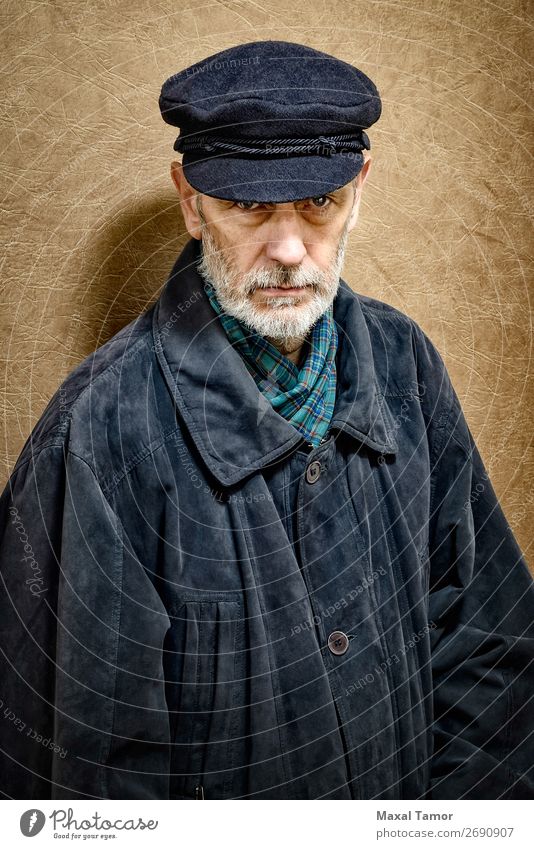 Portrait of a Man with Beard and a Cap Face Ocean Homosexual Adults Jacket Coat Leather Scarf Old Cool (slang) Strong Black White attractive bad bad boy bandit