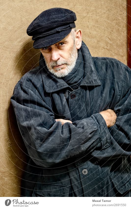 Portrait of a Man with Beard and a Cap Face Ocean Homosexual Adults Jacket Coat Leather Scarf Old Cool (slang) Strong Black White attractive bad bad boy bandit