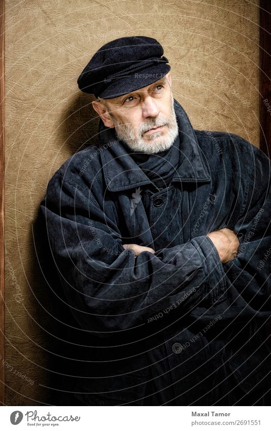 Portrait of a Man with Beard and a Cap Face Ocean Homosexual Adults Jacket Coat Leather Scarf Old Cool (slang) Strong Black White attractive bad bad boy bandit