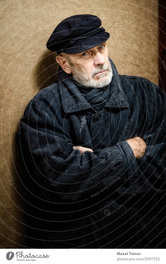 Portrait of a Man with Beard and a Cap Face Ocean Homosexual Adults Jacket Coat Leather Scarf Old Cool (slang) Strong Black White attractive bad bad boy bandit