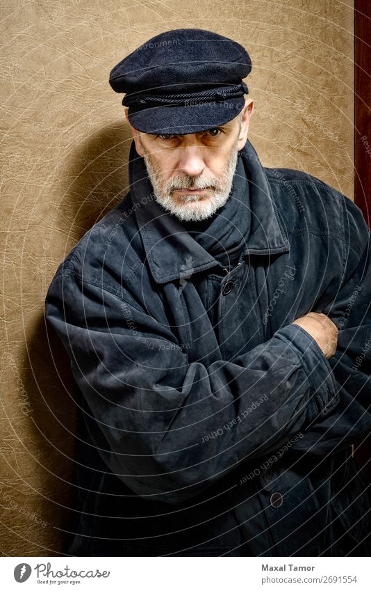 Portrait of a Man with Beard and a Cap Face Ocean Homosexual Adults Jacket Coat Leather Scarf Old Cool (slang) Strong Black White attractive bad bad boy bandit