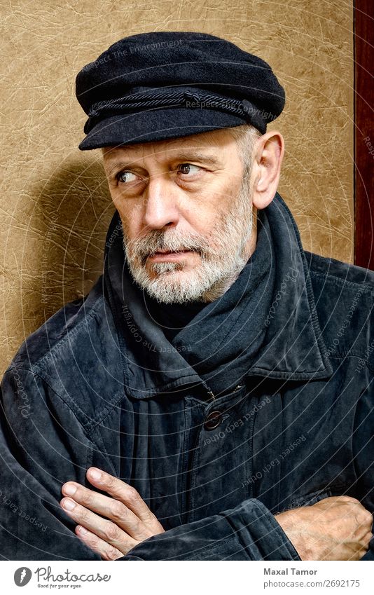 Portrait of a Man with Beard and a Cap Face Ocean Homosexual Adults Jacket Coat Leather Scarf Old Cool (slang) Strong Black White attractive bad bad boy bandit