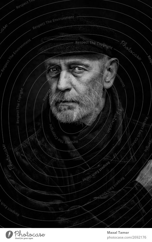 Portrait of a Man with Beard and a Cap Face Ocean Homosexual Adults Jacket Coat Leather Scarf Old Cool (slang) Strong Black White attractive bad bad boy bandit