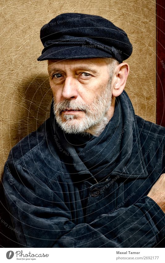 Portrait of a Man with Beard and a Cap Face Ocean Homosexual Adults Jacket Coat Leather Scarf Old Cool (slang) Strong Black White attractive bad bad boy bandit